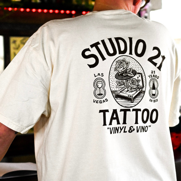 Studio 21 Tattoo Las Vegas NV Vino & Vinyl cream and black t-shirt with vino & vinyl graphic 