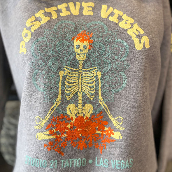 Studio 21 Tattoo Las Vegas NV  Positive vibes Hoodie with skeleton graphic with colorful studio 21 logo 